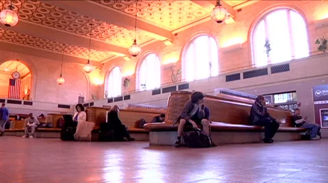 Train station people waiting for train, walk by, low angle shot commuters. Stock Footage 45869544