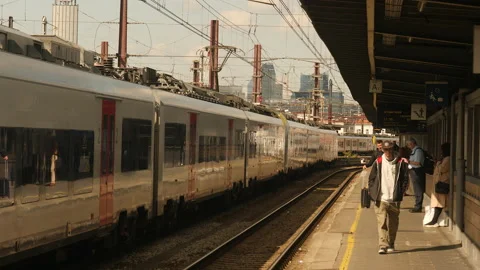 Train station platform in Brussels with passengers and train waiting. Belgium. Stock Footage 217931142
