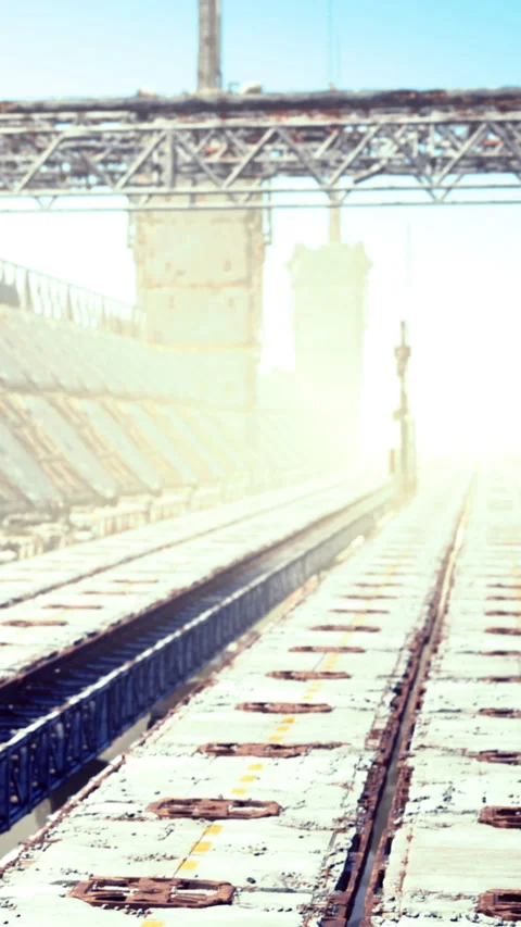 Train station platform with empty tracks and clear sky in daylight Stock Footage 335969109