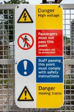 Train station platform gate warning signage Stock Photos