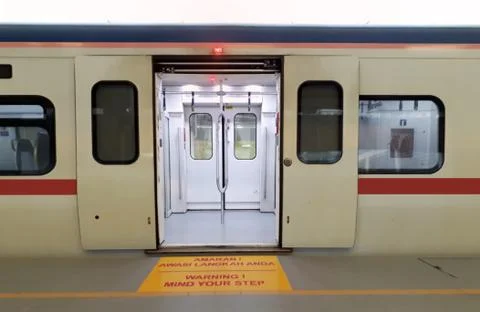 Train at station platform with open door Stock Photos