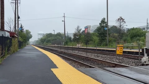 Train Station Platform on a Rainy Day Stock Footage 250205944