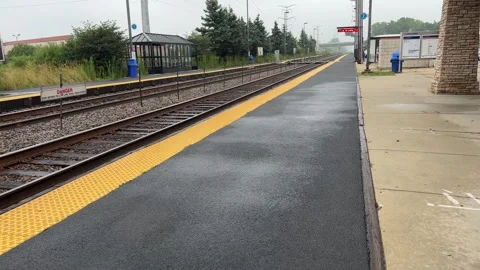 Train Station Platform on a Rainy Day Stock Footage 250205950