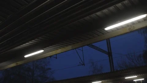 Train station platform roof ceiling neon light lamp at night Video stock 182930765