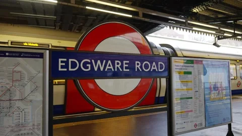 A train station with a red and white sign that says Edgware Road Stock Footage 297859150