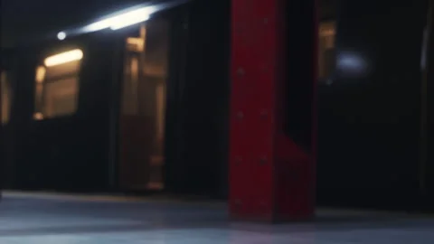Train station scene with empty platform and subway cars in background Stock Footage 348557036