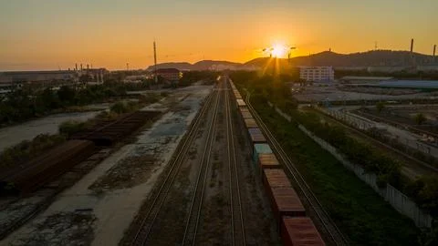 Train station at sunset , Cargo container train in evening import export cu.. Foto stock