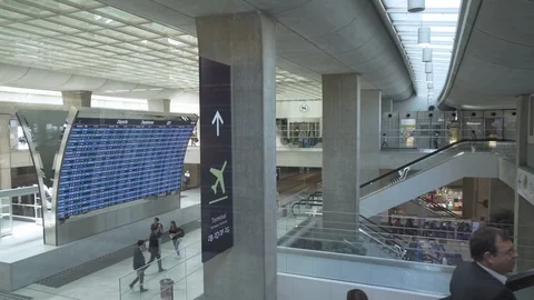 Train station terminal building interior with departure board and esculaters Stock Footage 119821480