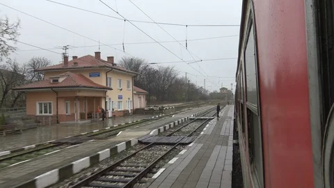 Train Station view from moving train in rainy day Stock Footage 101173380