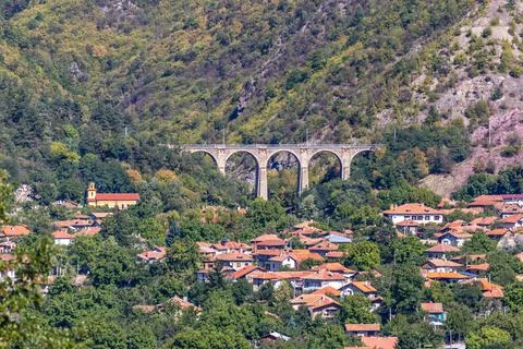 The train stone bridge in the mountains Stock Photos