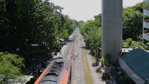 Train Stops to Unload Passengers at Overgrown Platfrom Video stock 89879530