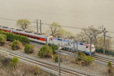 A train through the riverside of Korea Stock Photos