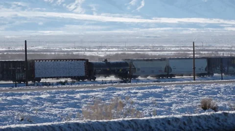 Train through white and blue snow scape med Stock Footage 58788244