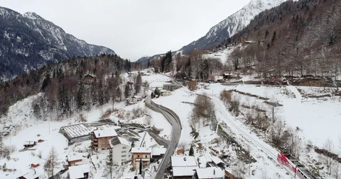 Train TMR between Salvan and Les Marécottes -Snowing Aerial 4K Stock Footage 104598145
