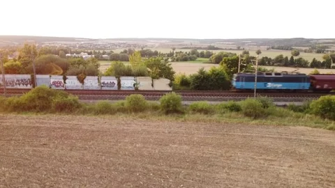 Train track and traing crossing during the sunset Stock Footage 152578673