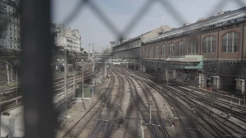 Train Track Through a Fence At Gare Saint Lazare in Paris Stock Footage 107700402