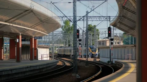 Train track with train on it and building in the background. Stock Footage 245098380