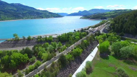 Train tracked by drone with tilt and beautiful landscape Stock Footage