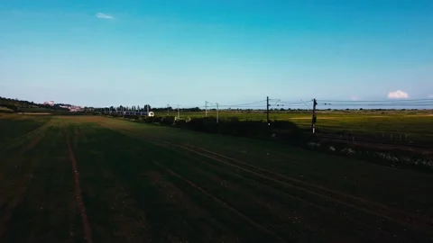 Train tracking drone shot, bright sunlight, 4k Stock Footage 168949156