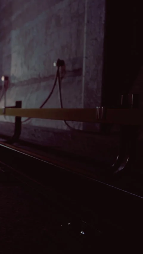 Train tracks and platform at a subway station during evening hours Stock Footage 334726221