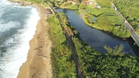 Train tracks between lagoon and ocean - Port Shepstone, South Africa Video stock 197464239