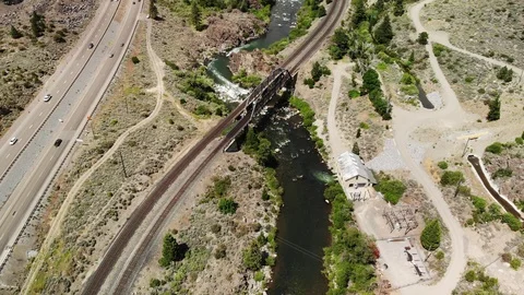 Train Tracks with Bridge and Highway near Truckee River - Aerial Drone Stock Footage 111989151