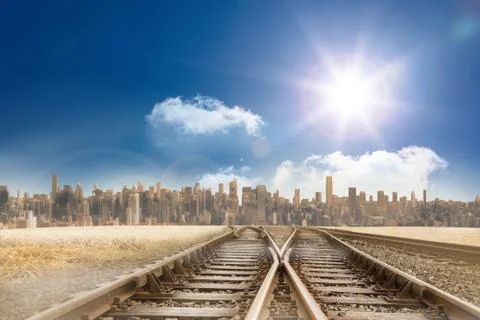 Train tracks leading to city under blue sky Stock Illustration