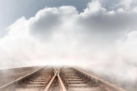 Train tracks leading over the cloudy horizon Ilustração Stock