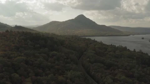 Train tracks leading towards a mountain in the distance on a hazy fall Video stock 142223405