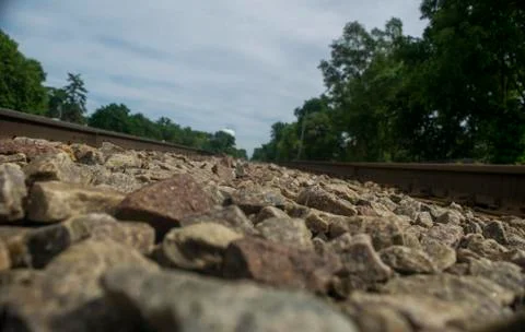 Train tracks with rocks in foreground Stock Photos