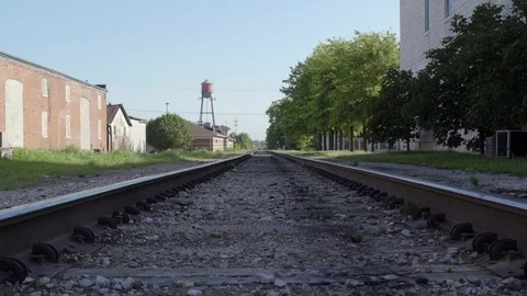 Train Tracks Run By A Water Tower In A Small Town Stock Footage 87480388