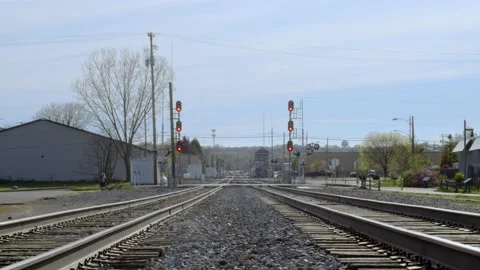 Train tracks running through town. 4k60p Stock Footage 130817558