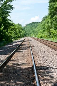 Train tracks through the woods Stock Photos