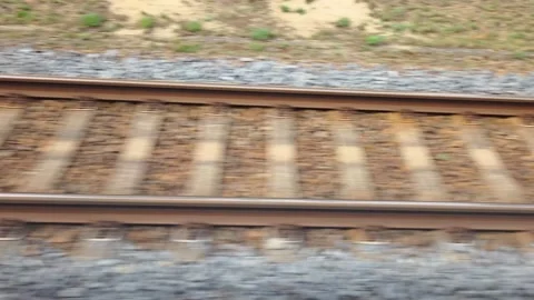 Train tracks viewed from a moving train, showing the continuous progression Stock Footage 337304278