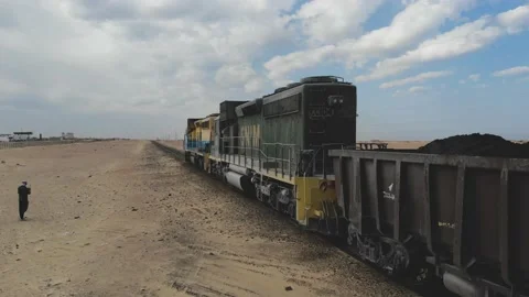 Train. Train in Mauritania. Train carrying coal. Industry in Mauritania. Film Stock Footage 137491971