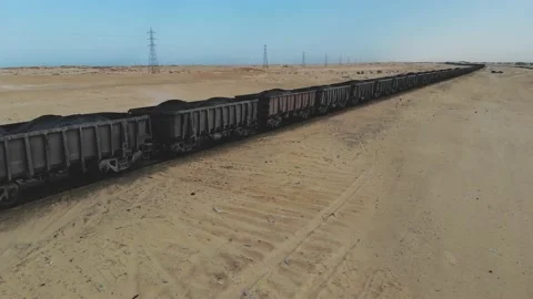 Train. Train in Mauritania. Train carrying coal. Industry in Mauritania. Film Stock Footage 137492087