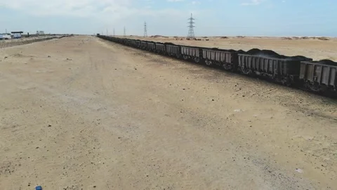Train. Train in Mauritania. Train carrying coal. Industry in Mauritania. Film Stock Footage 137492149