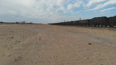 Train. Train in Mauritania. Train carrying coal. Industry in Mauritania. Film Stock Footage 137492233