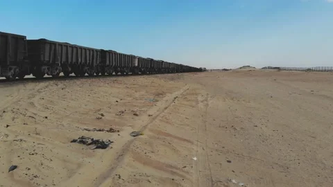 Train. Train in Mauritania. Train carrying coal. Industry in Mauritania. Film Stock Footage 137492264