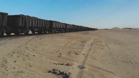Train. Train in Mauritania. Train carrying coal. Industry in Mauritania. Film Stock Footage 137492277
