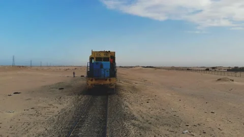 Train. Train in Mauritania. Train carrying coal. Industry in Mauritania. Film Stock Footage 137493413