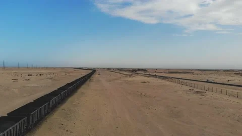 Train. Train in Mauritania. Train carrying coal. Industry in Mauritania. Film Stock Footage 137493436
