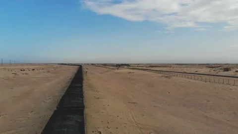 Train. Train in Mauritania. Train carrying coal. Industry in Mauritania. Film Stock Footage 137493469