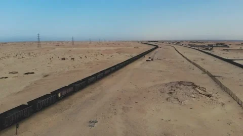 Train. Train in Mauritania. Train carrying coal. Industry in Mauritania. Film Stock Footage 137493696