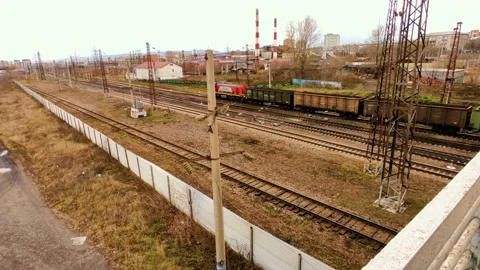The train transports coal, the background is heating pipes Stock Footage 219763660