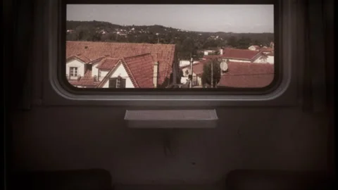 Train Travel Retro 16mm Empty Seats Window View Countryside Old Film Texture Video stock 256980474