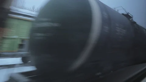 Train travel in winter. view from the window. another train passes by Видео 100665945