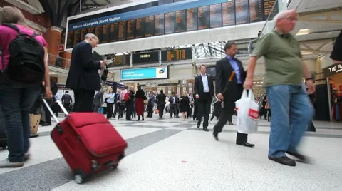 Train travelers in London railway station Stock Footage