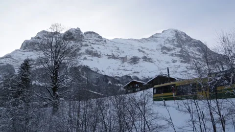 A Train Travelling through Grindelwald. Vídeo Stock 153325732