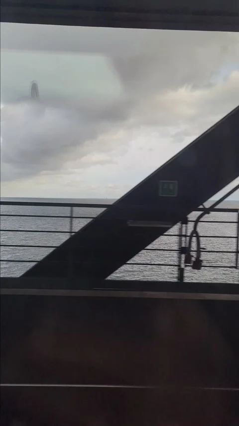 The train travels across the bridge between Malm and Copenhagen Stock Footage 288201037